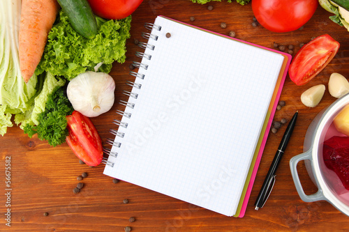 Fresh vegetables and spices and paper for notes,
