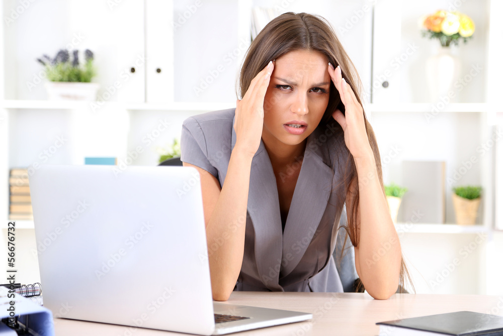 Young business woman in office Young business woman in office