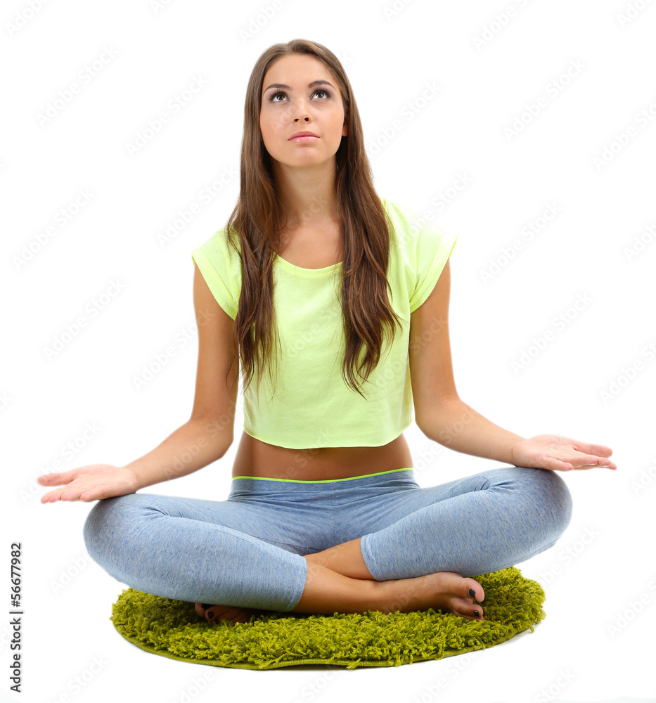 Young beautiful fitness girl doing yoga exercise isolated