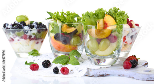 Fruit salad in glasses, isolated on white