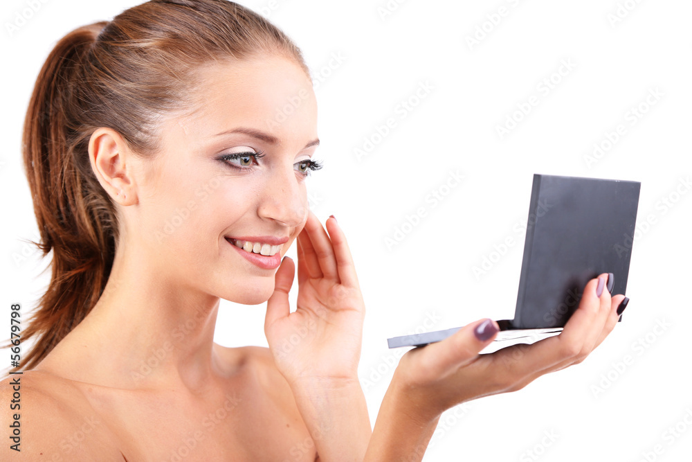 Beautiful girl preens before small mirror isolated on white Beautiful girl preens before small mirror isolated on white