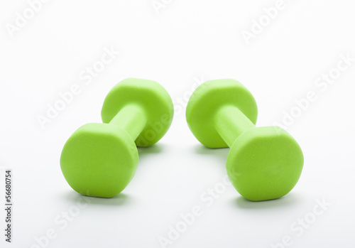 small green dumbbells, isolated in white background