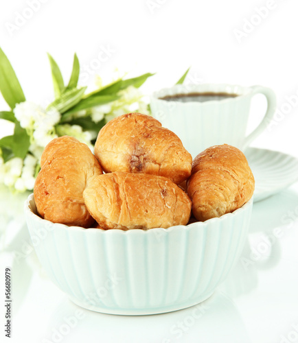 Tasty croissants and cup of coffee isolated on white