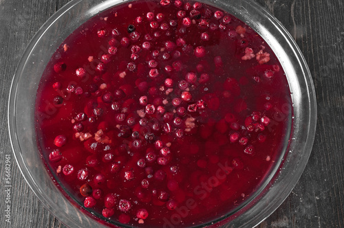 stewed cranberries and other berries in a large glass bowl photo