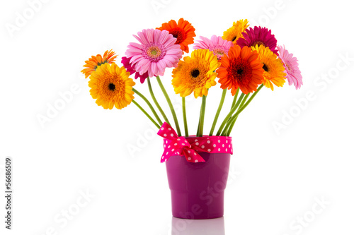 Purple vase with colorful flowers