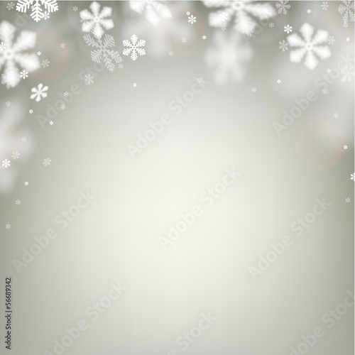 Christmas background with defocused snowflakes.