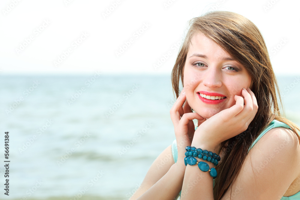 young beautiful woman portrait on the beach