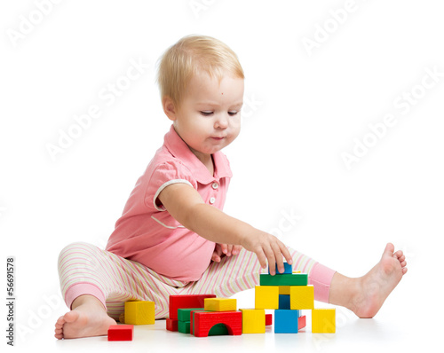 kid girl playing with woode...