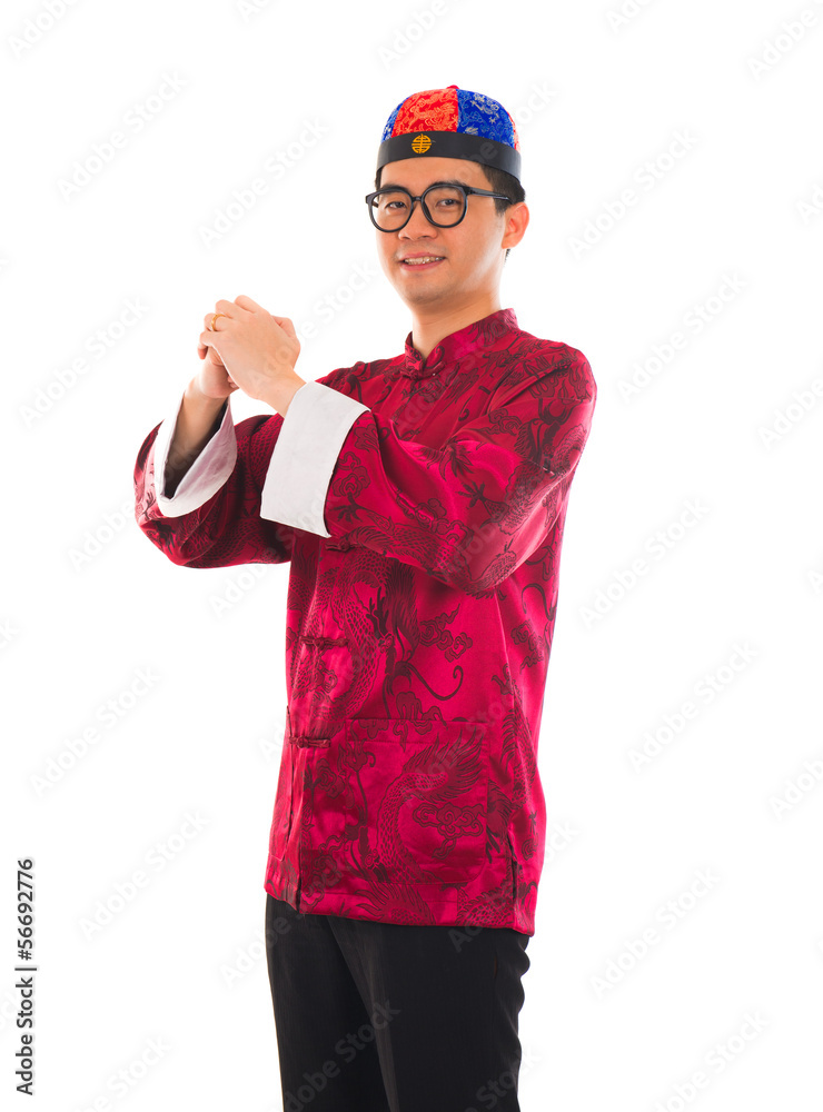 Asian man with Chinese traditional dress cheongsam and gong xi f Asian man with Chinese traditional dress cheongsam and gong xi f