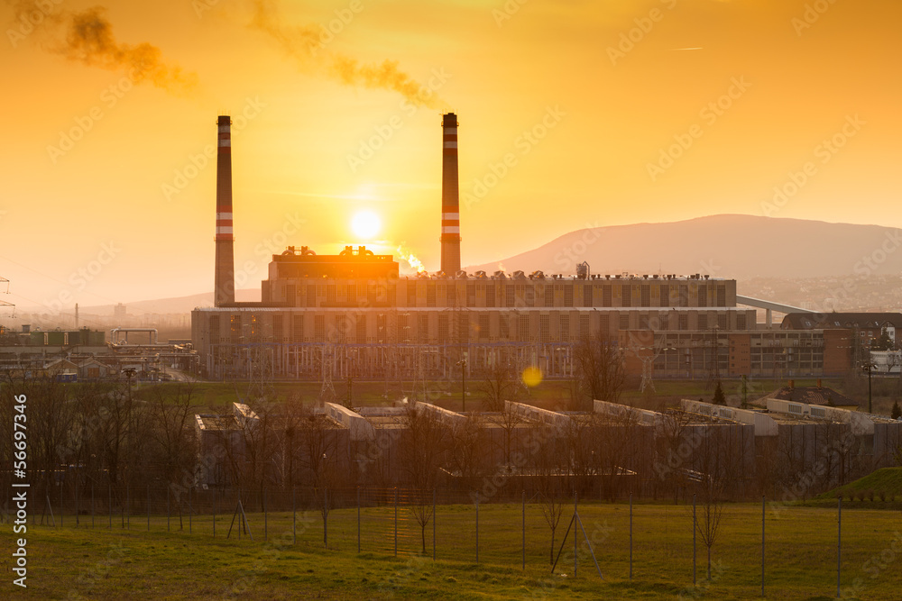 factory smoke at sunset