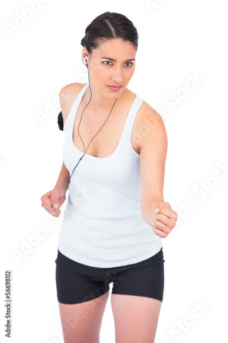 Serious fit model jogging © lightwavemedia