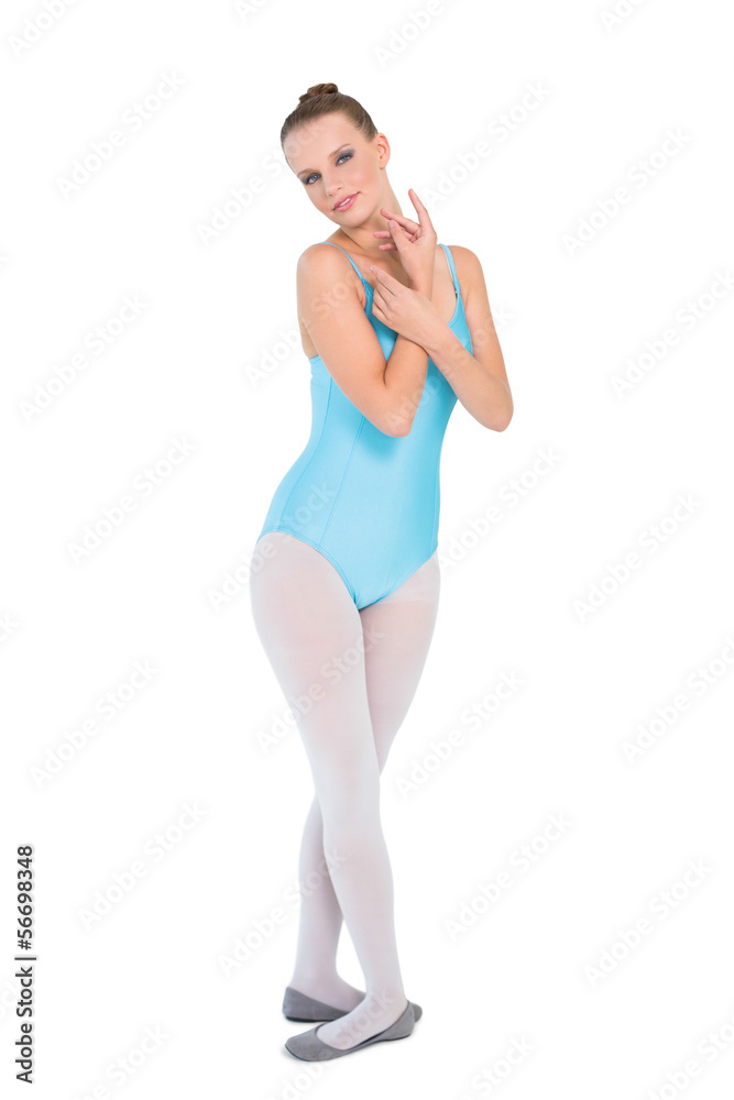 Serious pretty ballerina posing looking at camera Serious pretty ballerina posing looking at camera