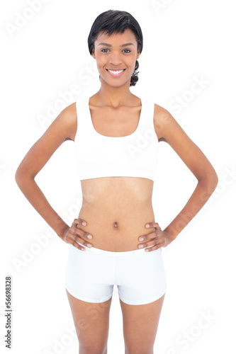Attractive fit woman posing hands on the hips © lightwavemedia
