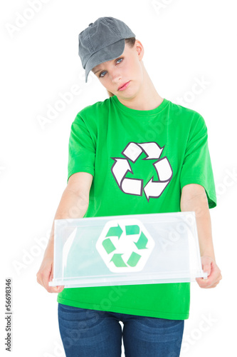Stern pretty environmental activist holding an empty recycling b