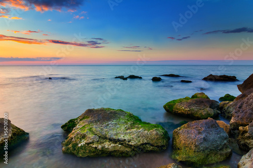 stony sea coast at the evening
