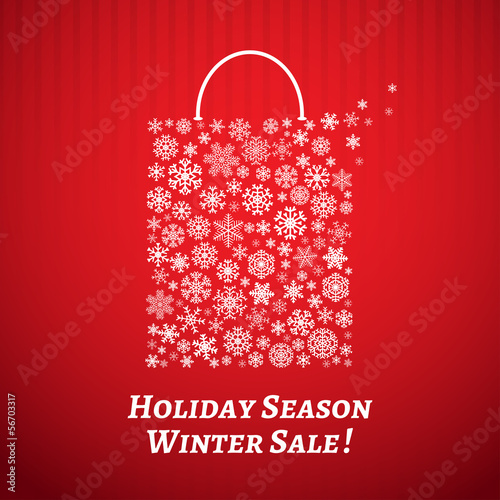 Christmas background with a shopping bag from white snowflakes