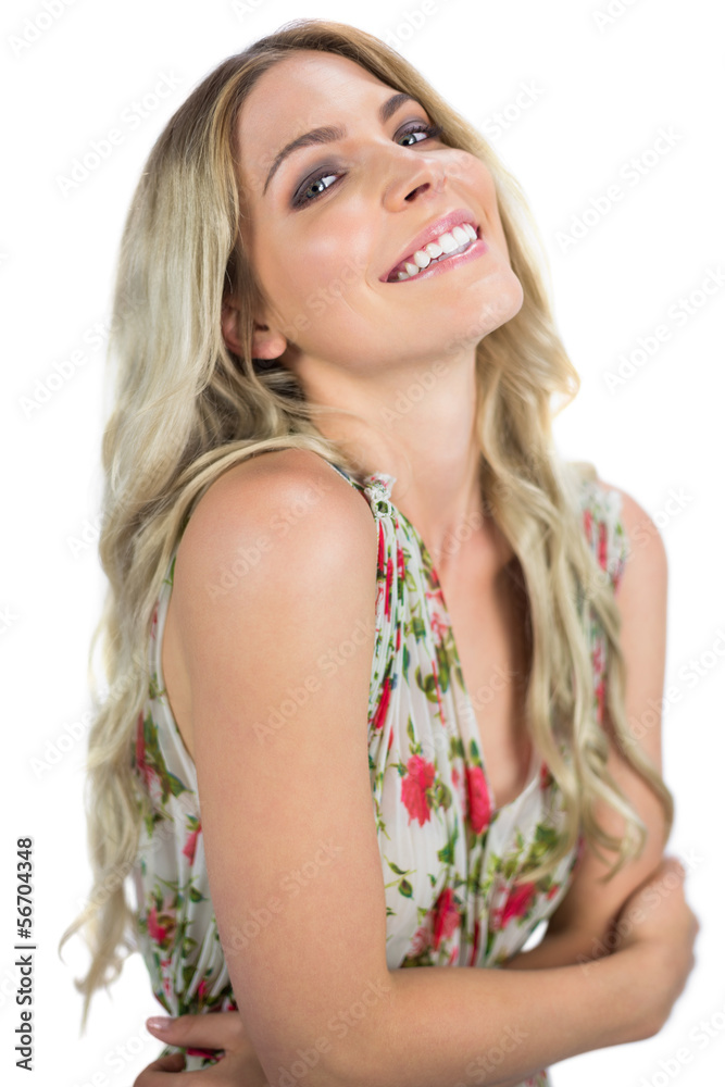 Cheerful seductive blonde wearing flowered dress posing Cheerful seductive blonde wearing flowered dress posing