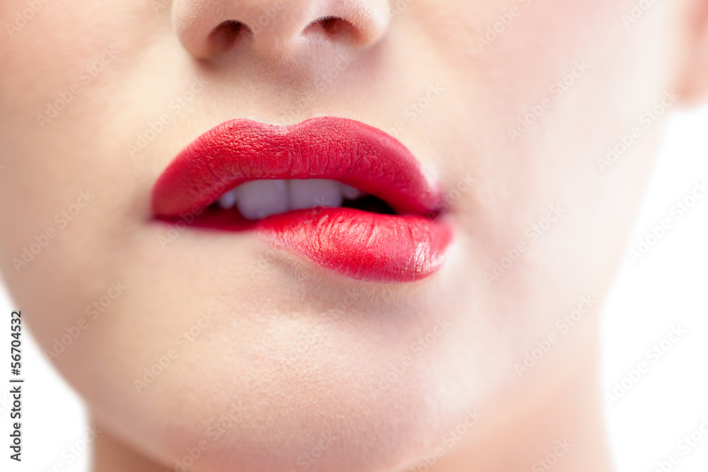 Close up on gorgeous model biting red lips Close up on gorgeous model biting red lips