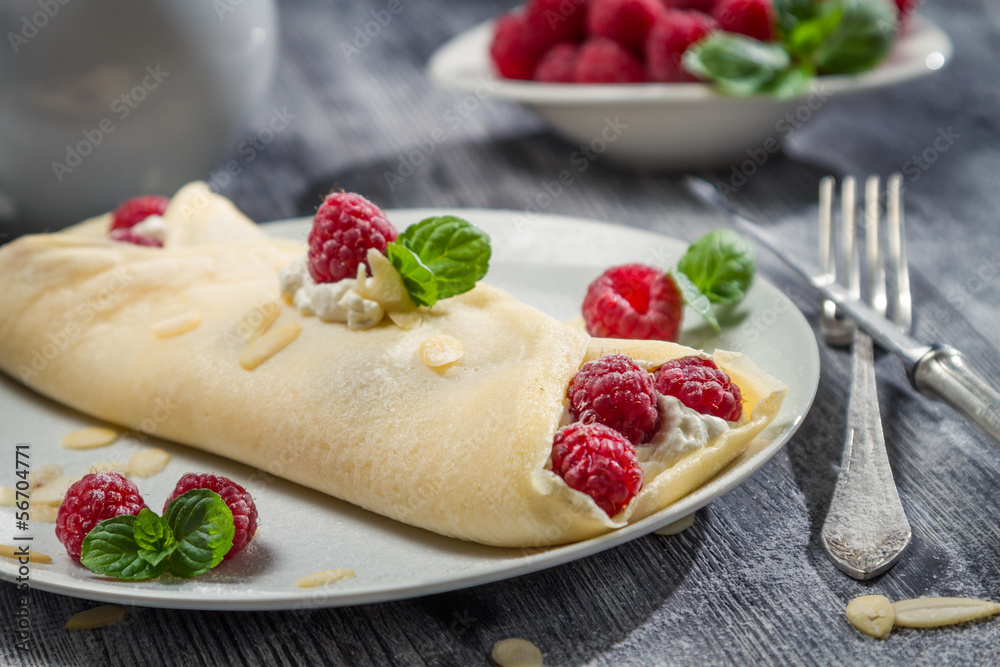 Raspberry pancakes sprinkled with icing sugar Raspberry pancakes sprinkled with icing sugar