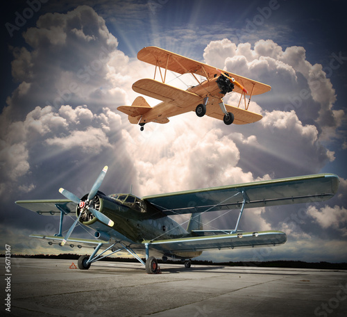 Obraz na plátně Retro style picture of the biplanes. Transportation theme.