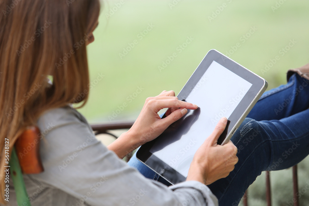 Closeup of woman using digital tablet