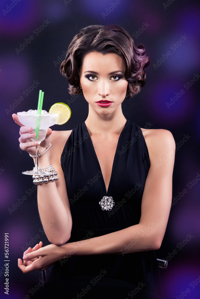 Beautiful elegant girl with a martini glass Beautiful elegant girl with a martini glass