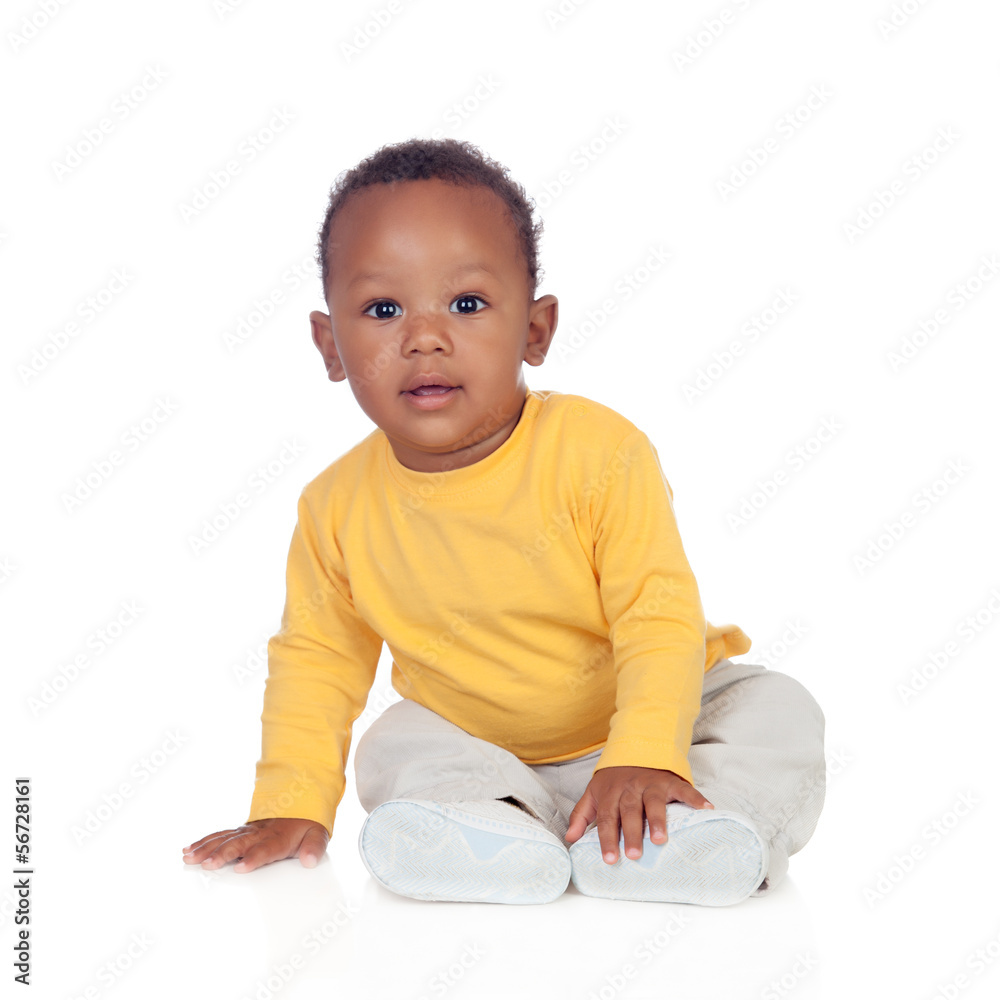 Adorable african baby sitting on the floor Adorable african baby sitting on the floor