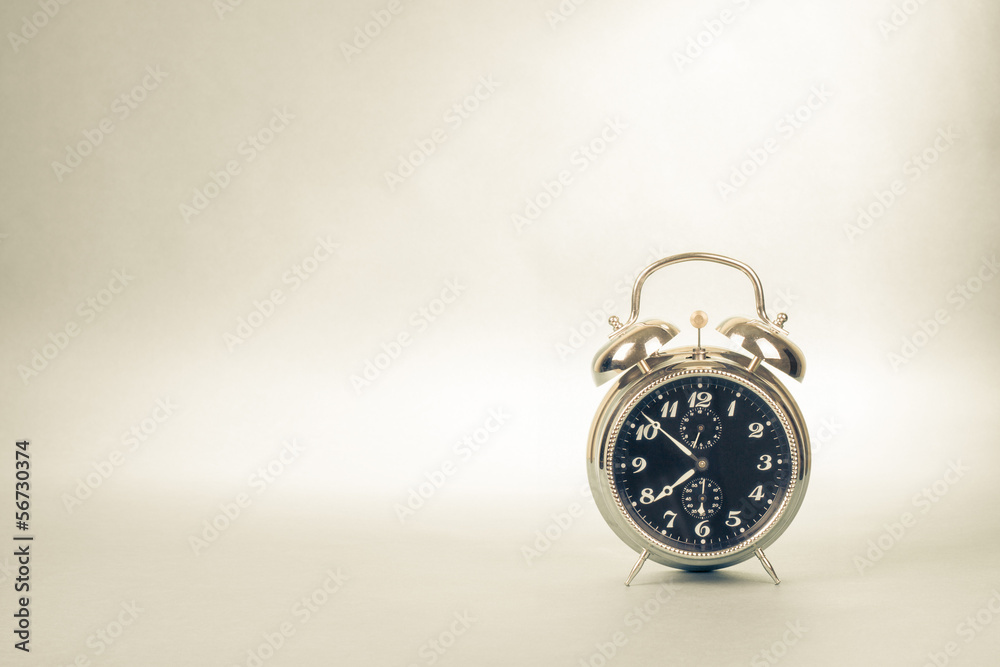 Retro alarm clock photo for vintage sepia background