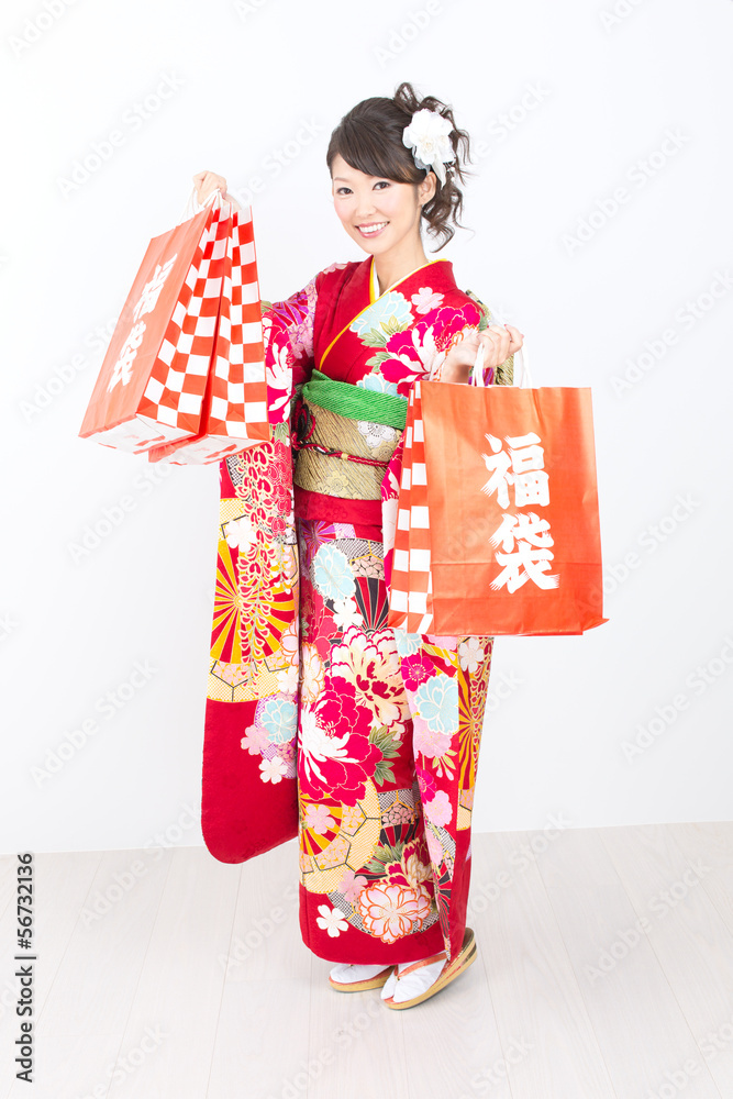 Beautiful asian kimono woman on white background Beautiful asian kimono woman on white background