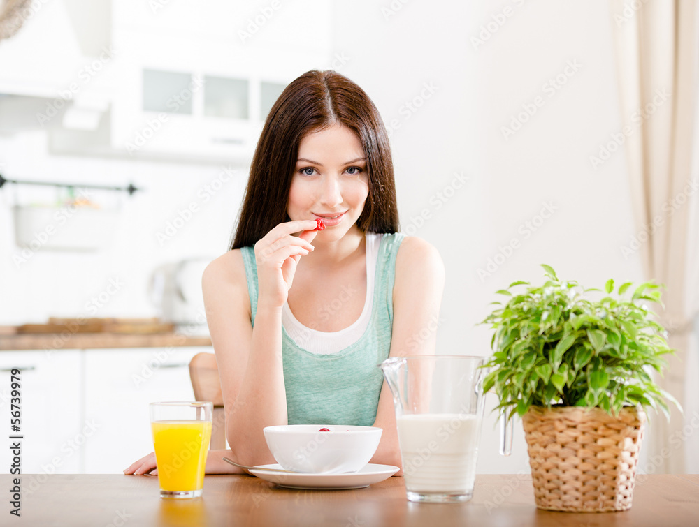 Portrait of the girl eating healthy muesli
