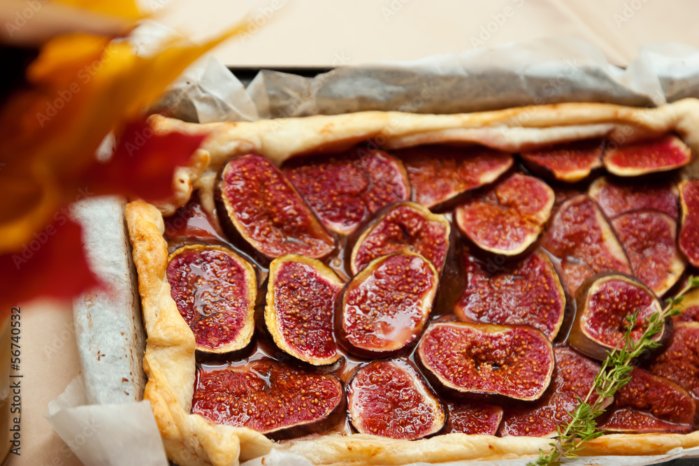 Homemade fig pie with brie cheese and honey