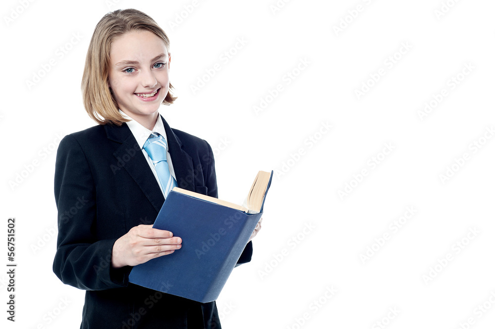 Smiling business girl reading a book Smiling business girl reading a book