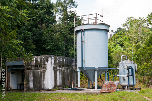 water storage tank in a rural area for supply of drinking water photo