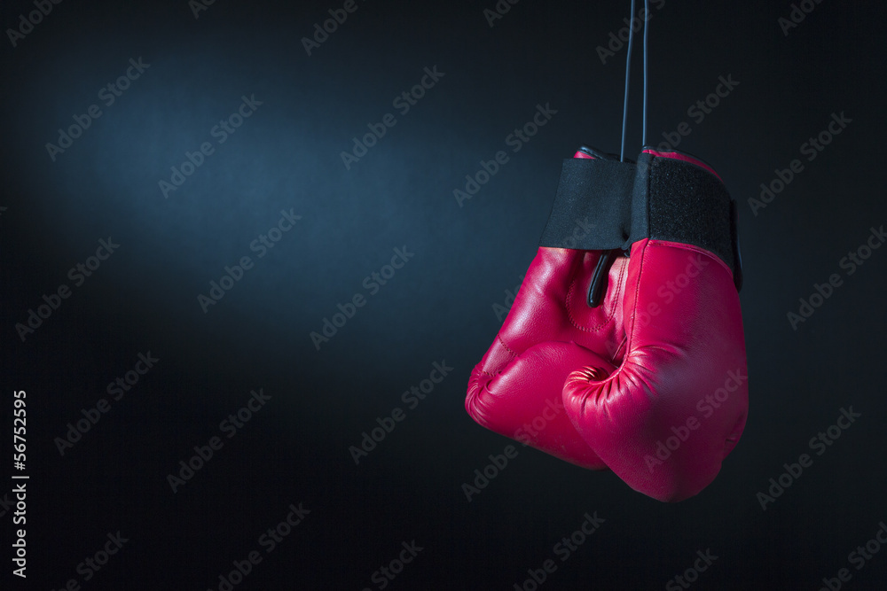 Boxing gloves on a dark background.