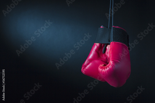 Boxing gloves on a dark background.