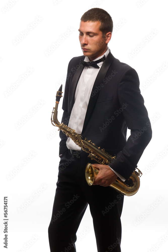 Naklejka premium Isolated portrait of young saxophonist in suit with tie