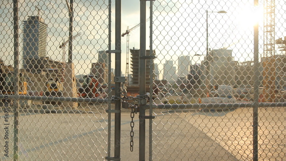 Locked gate at construction worksite. Shallow depth of field. Locked gate at construction worksite. Shallow depth of field.