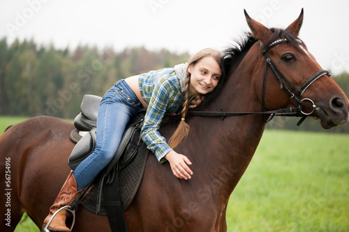 girl embraces a horse