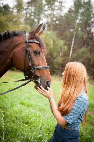 The girl with red hair and a white horse © kalinina_alisa