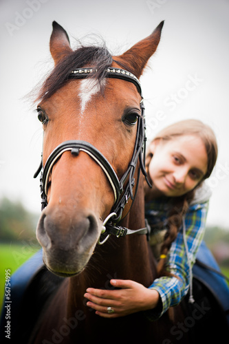 Portrait of a girl with a horse