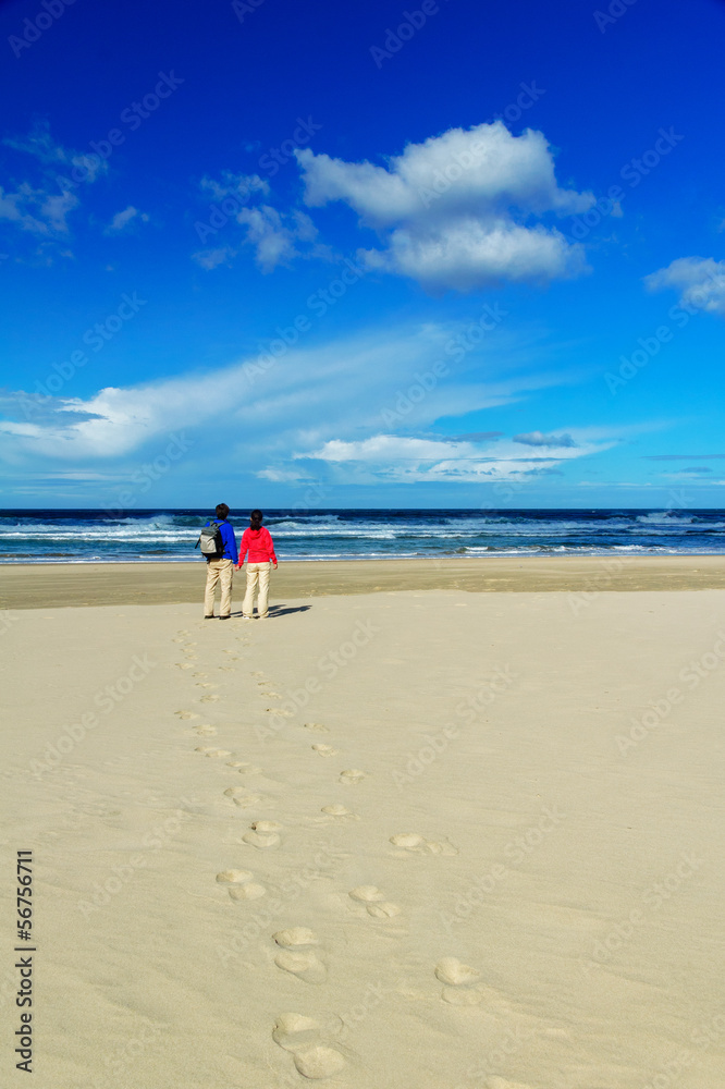 Happy couple on beautiful ocean beach, romantic vacation i