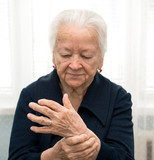 Senior woman measuring her pulse