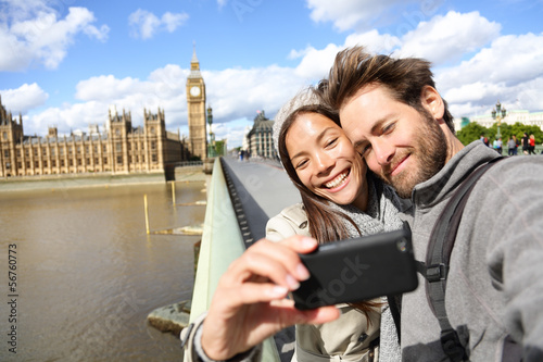 Canvas Print London tourist couple taking photo near Big Ben