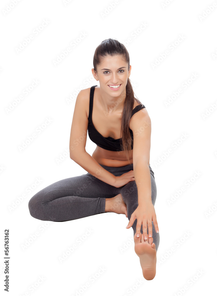 Woman doing stretching exercises in a gym