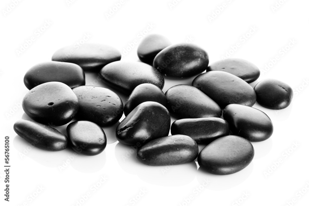Black massage stones isolated Black massage stones isolated