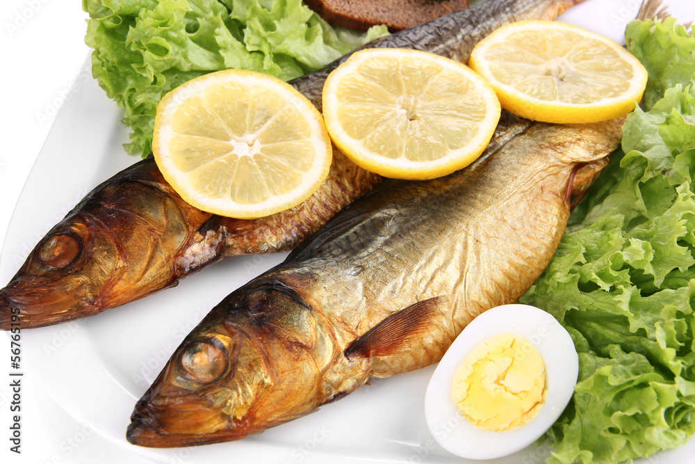 Smoked fish on plate close up