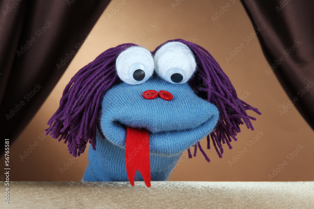 Fototapeta premium Puppet show on brown background
