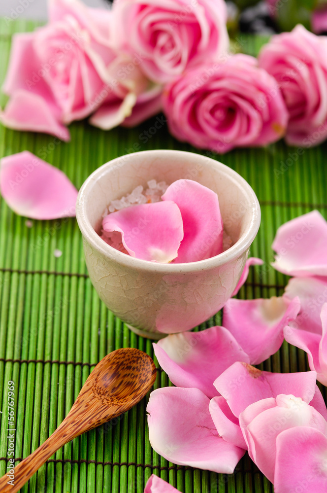 Spa Concept: Rose petals, spoon, salt in bowl
