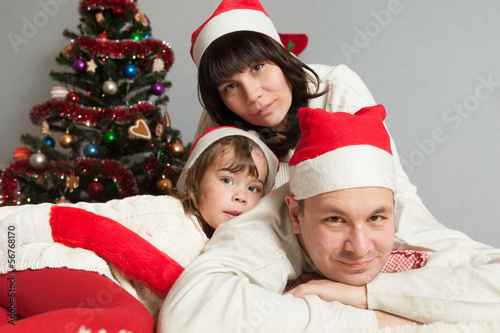 Happy family near the Christmas tree