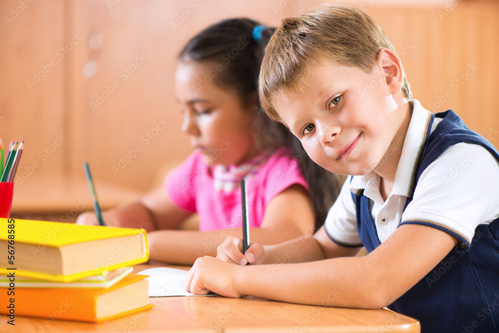 Portrait of cute schoolboy during lesson Portrait of cute schoolboy during lesson